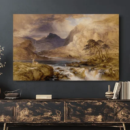 Stag beside a mountain lake with towering cliffs, windswept trees and cascading water beneath a cloudy sky